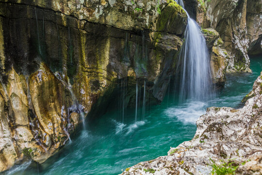Small waterfall in Soca river gorge near Bovec village, Slovenia