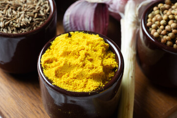 Spices and herbs in ceramic bowls. Food and cuisine ingredients. Colorful natural additives.