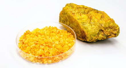 uranium nitrate called uranyl, with uranium ore, radioactive material on isolated white background © RHJ