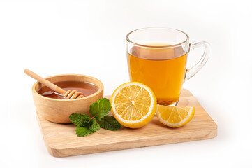 Cup of tea with lemon, honey and mint  on white background.