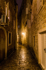 Fototapeta na wymiar Evening view of an alley in the old town in Budva, Montenegro