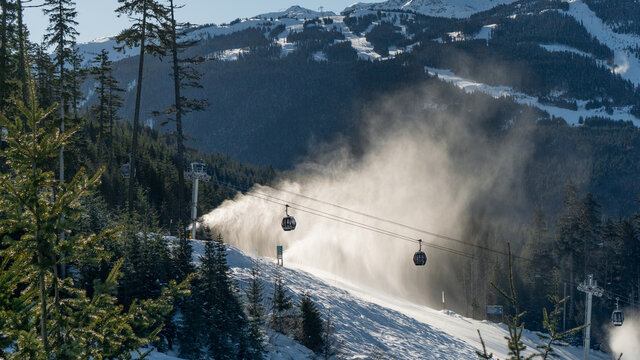 Gondola Heading Up Whistler Mountain In Front Of Snowgun