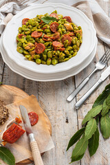 Broad bean with chorizo on vintage background. Typical portuguese food