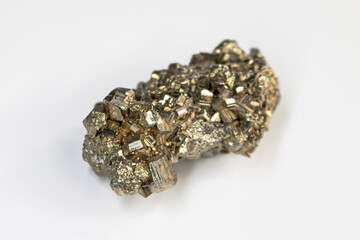 Elongated pyrite fools gold cluster on a neutral white background.