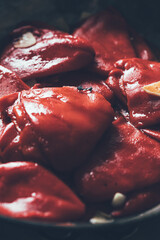 Close up of roast piquillo peppers with garlic