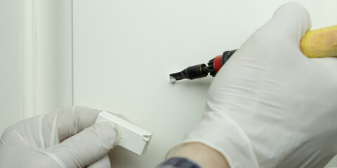 restoration of wooden doors with wax and a soldering iron.