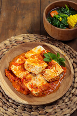 Sambal santan tahu or tofu in spicy coconut milk sauce served with spinach soup.