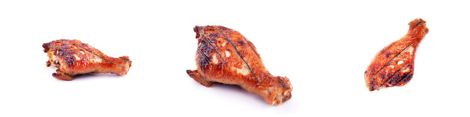 panorama of grilled fried chicken legs on a white background