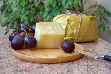 Pecorino Romano cheese with red grapes