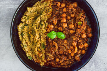 plant-based food, vegan moroccan cous cous with chickpea onion and mushroom stew with plenty of spices and herbs