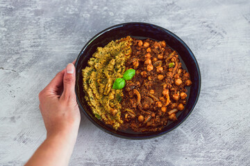 plant-based food, vegan moroccan cous cous with chickpea onion and mushroom stew with plenty of spices and herbs