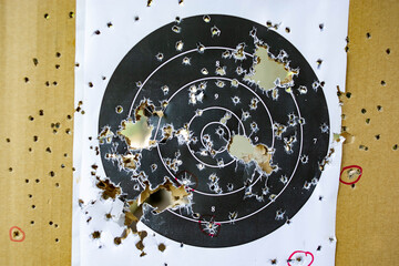 target made of paper It was pierced by a lot of bullets.