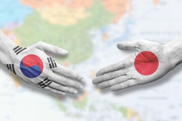 South Korea and Japan - Flag handshake symbolizing partnership and cooperation