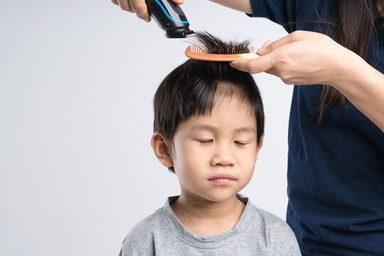 Asian Boy Got Hair Cut At Home By His Mother With Electric Cordless Clippers