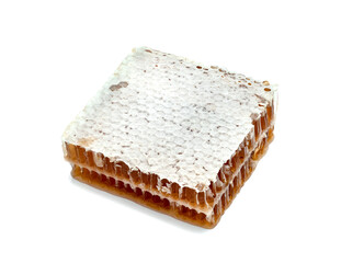 Fresh Honeycomb slice and honey isolated on white background