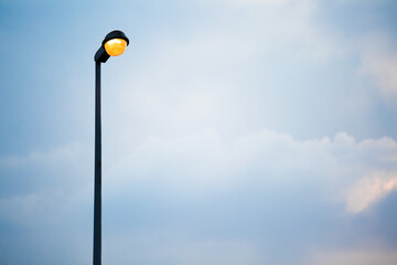 Street lamp on evening blue sky and clouds background  and copy space