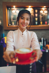 Barista making coffee in coffeeshop