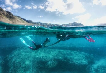 Fototapeta na wymiar Water Models Snorkeling in Hawaii 