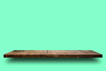 Empty old wooden table or shelves with green pastel background. Mockup product design.