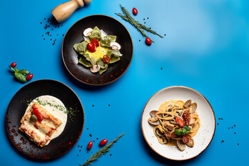 Menu of italian restaurant on a bright blue background, top view, studio photography