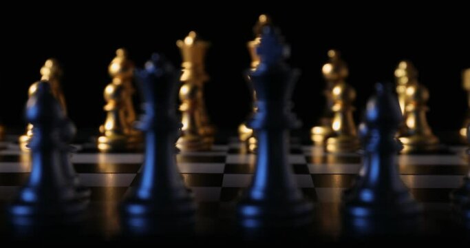 Board with chess pieces on dark background