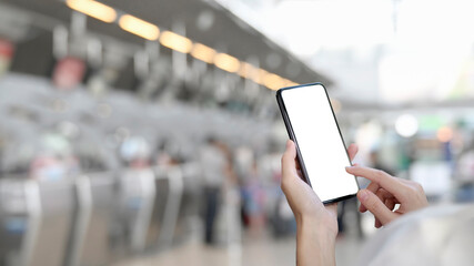 Hands using smartphone in crude clipping path in blurred background