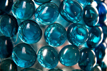 January 2021: Turquoise blue glass droplets forms a bubble-like texture on a repurposed wine bottle.