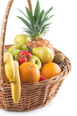 Fresh fruit in the basket against a white background