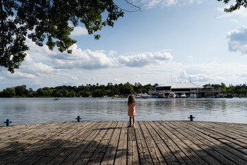 Girl looking into Dow's lake at the Rideau Canal Western Pathway during summer. Ottawa, Ontario,...