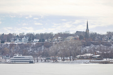 Houses sitting on a bluff overlooking a frozen river on a bitter cold day in Stillwater, Minnesota
