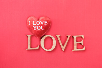 Love wooden font with red heart and i love you message, love and romance symbol, valentine card background idea