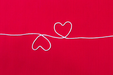 White heart on red fabric background, love and romance concept, valentine card background idea,...