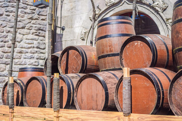 Wine barrels stacked in the old cellar of the winery