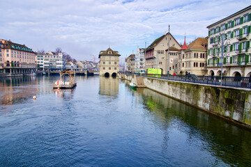 Fototapeta na wymiar River limmat with old town of Zurich, Switzerland, in the background.