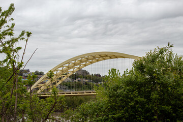 Daniel Carter Beard Bridge, yellow twin span steel bowstring arch bridge crossing the Ohio River in Cincinnati, Ohio.