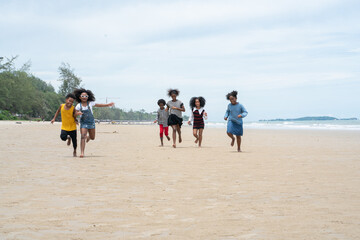 Fototapeta na wymiar family on the beach. group of kid african on the beach