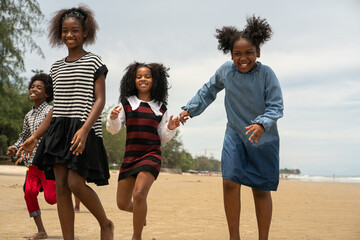 family holiday summer, kids happiness vacation on the beach, group of black family happy summer. 