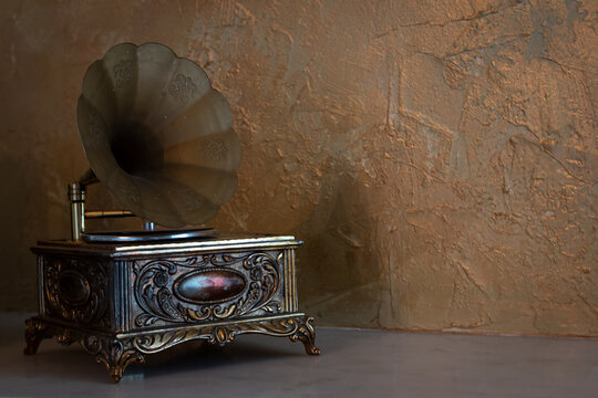 January 2021: Vintage music box against a gold venetian plaster backdrop.