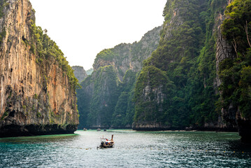 Plakat long-tailed boat is sailing into Maya Bay. Marine attractions Famous of Krabi Province, Thailand