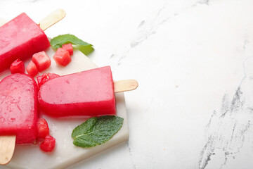 Composition with watermelon ice cream on light background