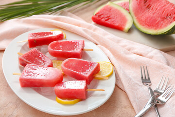 Plate with watermelon ice cream on light background