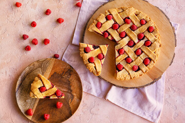 Delicious raspberry pie on color background