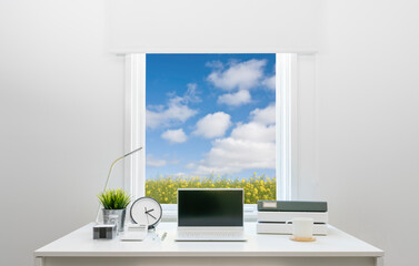 Fototapeta na wymiar Contemporary home office desk facing stylish window