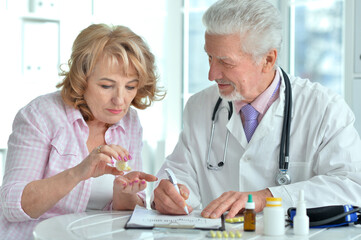 Senior doctor with elderly patient