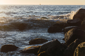 WAVES THUNDERING ON THE SHORE AT SUNSET