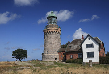 Fototapeta na wymiar lighthouse on the coast of sea,an old historic lighthouse on the island of Bornholm near the town of Allinge