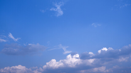 The clouds in the blue sky.