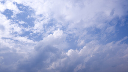 The clouds in the blue sky.