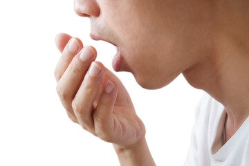Obraz na płótnie Canvas Oral health Men use hands to check for bad breath and breathe.