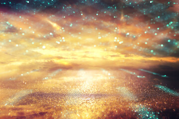 background of abstract gold and black glitter lights. defocused